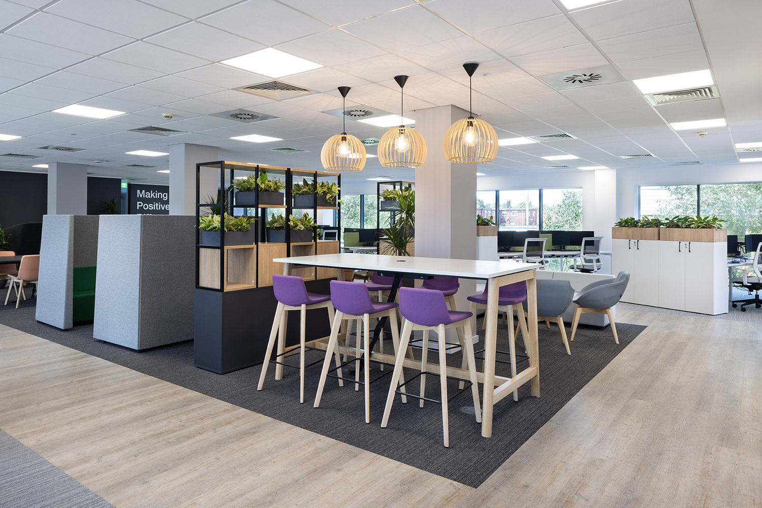 Energy & Utility Skills Office showing modern environment with tables, chairs and plants.